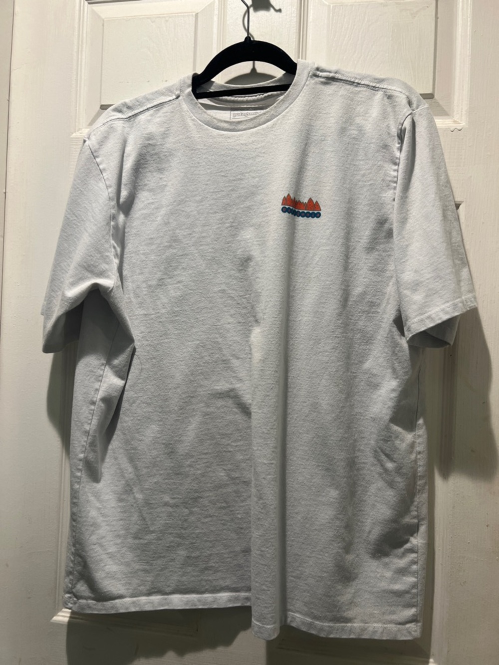 Patagonia White Short Sleeve Tee with Small Orange & Blue Graphic